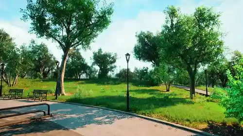 Serene park pathway with benches and green trees creating a peaceful walking environment